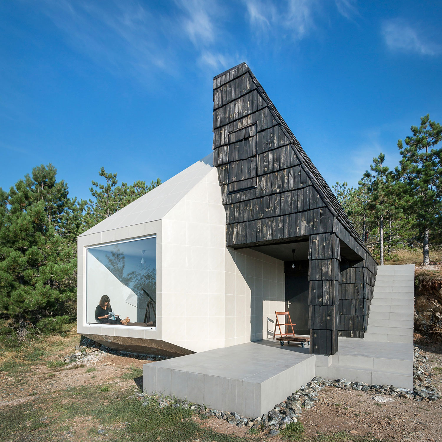 A Contemporary Mountain Home Enclosed by White Ceramic Tiles and Dark Wooden Shingles in Divčibare by EXE studio (2)