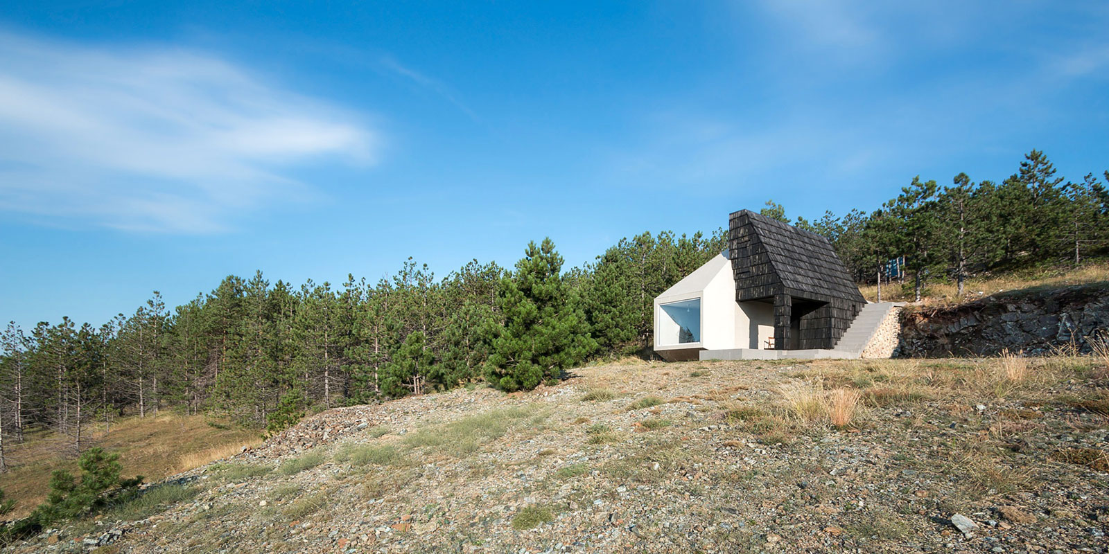 A Contemporary Mountain Home Enclosed by White Ceramic Tiles and Dark Wooden Shingles in Divčibare by EXE studio (3)