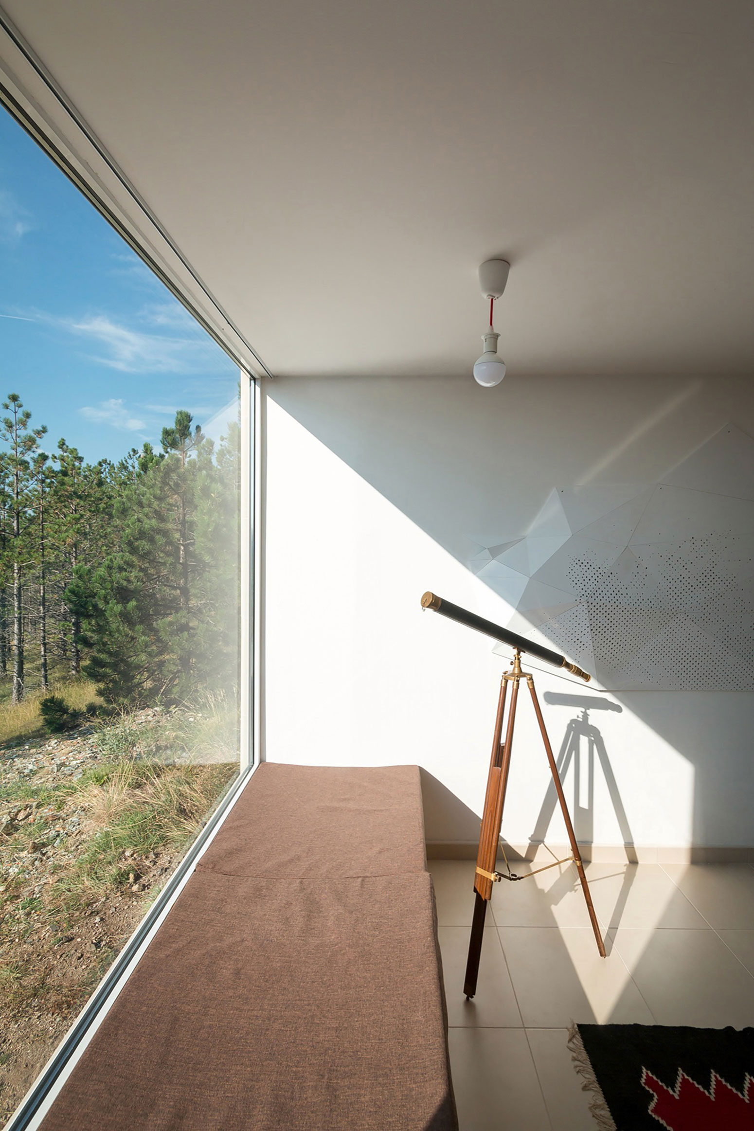 A Contemporary Mountain Home Enclosed by White Ceramic Tiles and Dark Wooden Shingles in Divčibare by EXE studio (8)