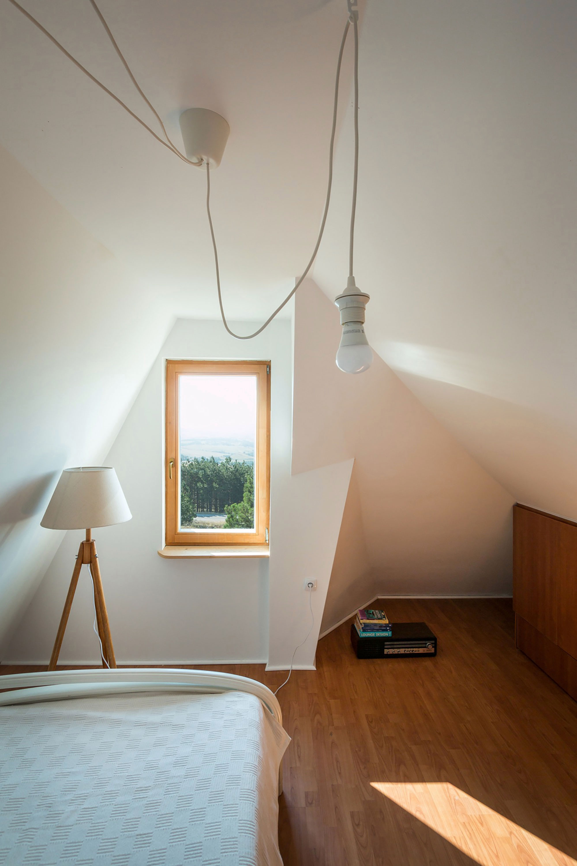 A Contemporary Mountain Home Enclosed by White Ceramic Tiles and Dark Wooden Shingles in Divčibare by EXE studio (9)