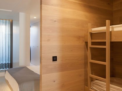 A Contemporary Seafront Apartment with Natural Wood Elements in Póvoa do Varzim by Pitagoras Group (13)