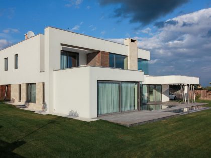 A House with Strict Geometry on Facades with Arrhythmic Columns in the Suburbs of Kiev