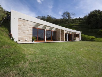 A Modern Concrete House Surrounded by a Green Roof and Basement Level in Guayllabamba, Ecuador by AR+C (1)