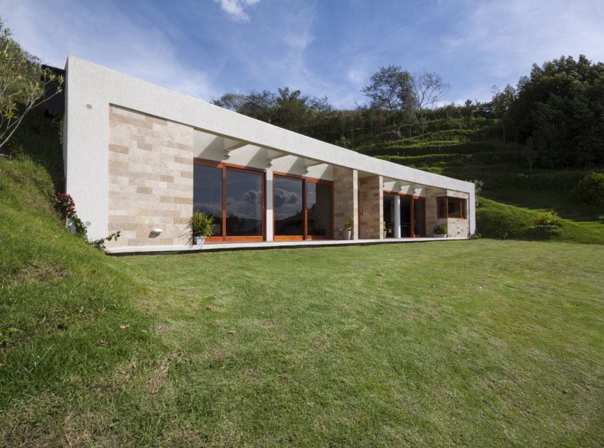 A Modern Concrete House Surrounded by a Green Roof and Basement Level in Guayllabamba, Ecuador by AR+C (1)