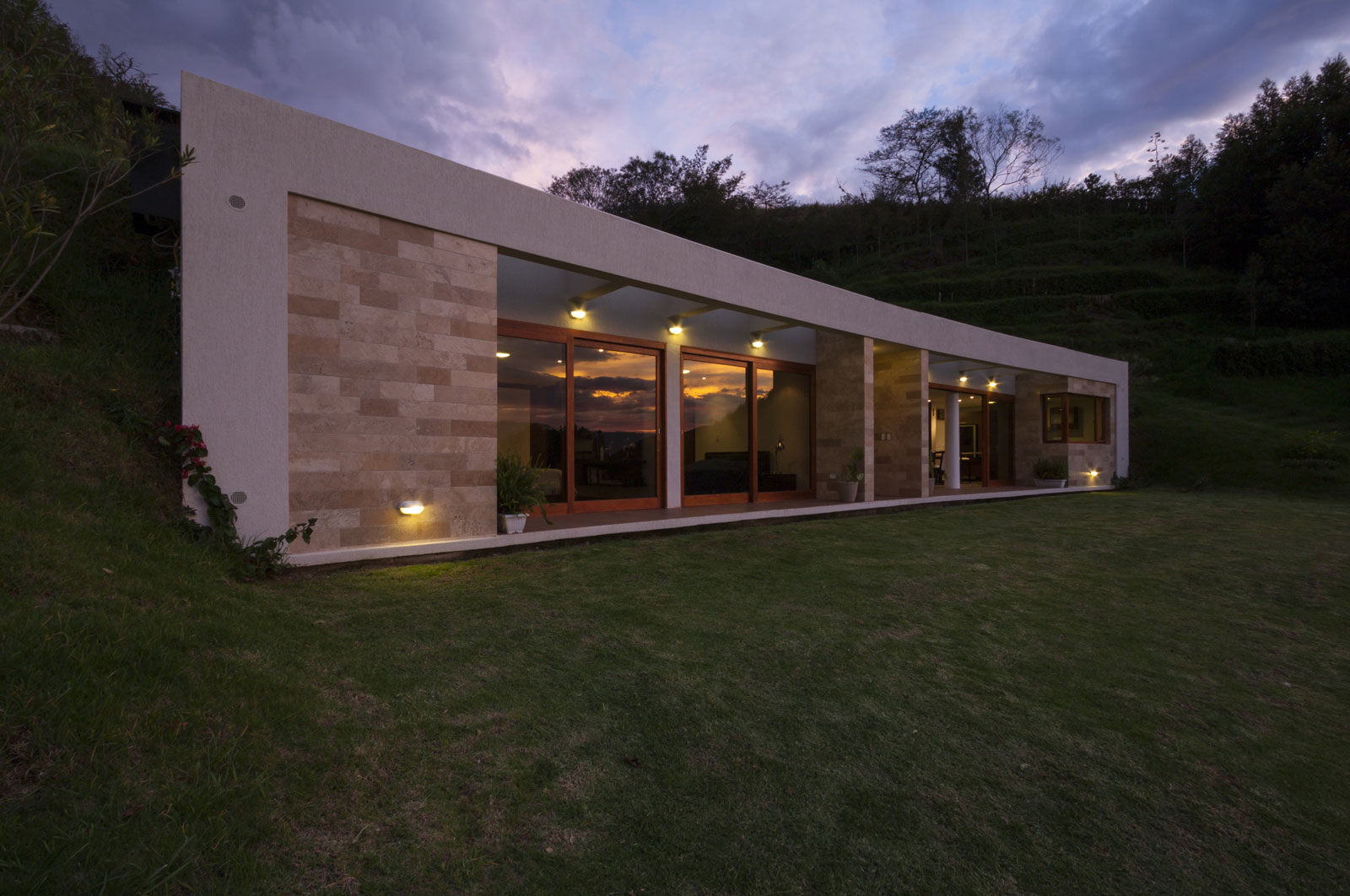 A Modern Concrete House Surrounded by a Green Roof and Basement Level in Guayllabamba, Ecuador by AR+C (12)