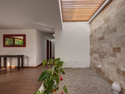 A Modern Concrete House Surrounded by a Green Roof and Basement Level in Guayllabamba, Ecuador by AR+C (8)