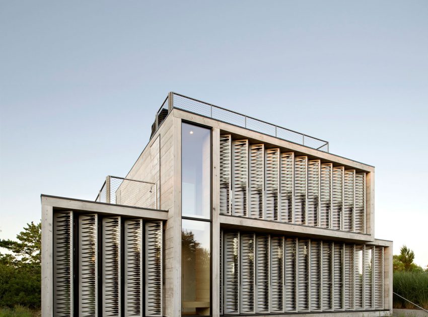 A Modern Home Surrounded by Rolling Dunes with Strips of Canvas in Amagansett by Bates Masi Architects (2)