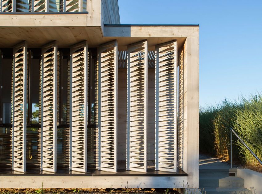 A Modern Home Surrounded by Rolling Dunes with Strips of Canvas in Amagansett by Bates Masi Architects (3)
