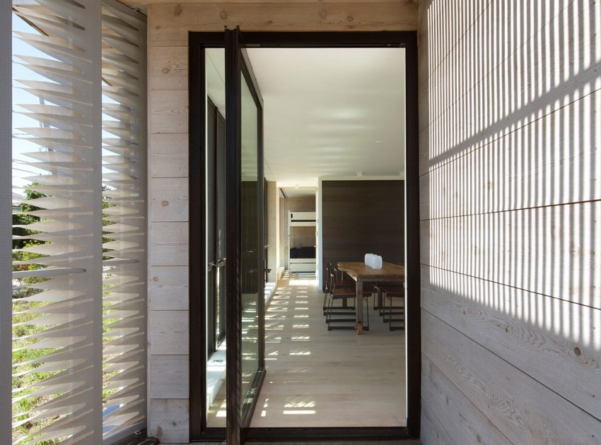 A Modern Home Surrounded by Rolling Dunes with Strips of Canvas in Amagansett by Bates Masi Architects (5)