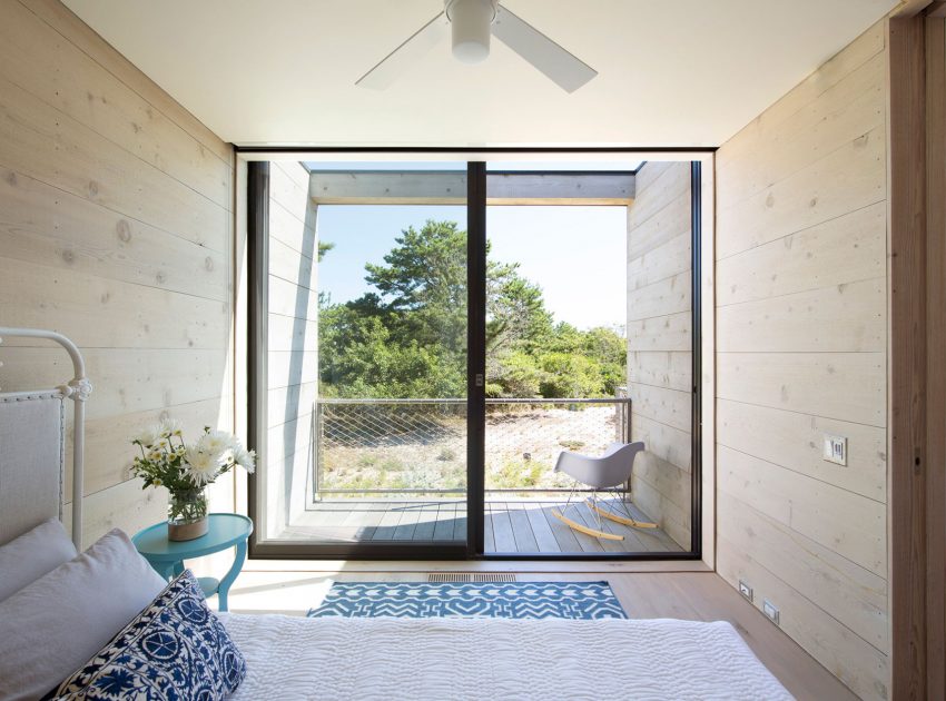 A Modern Home Surrounded by Rolling Dunes with Strips of Canvas in Amagansett by Bates Masi Architects (9)