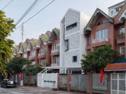 A Row House Transformed into a Bright Home with White Concrete Blocks in Vietnam by LANDMAK ARCHITECTURE (1)