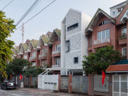 A Row House Transformed into a Bright Home with White Concrete Blocks in Vietnam