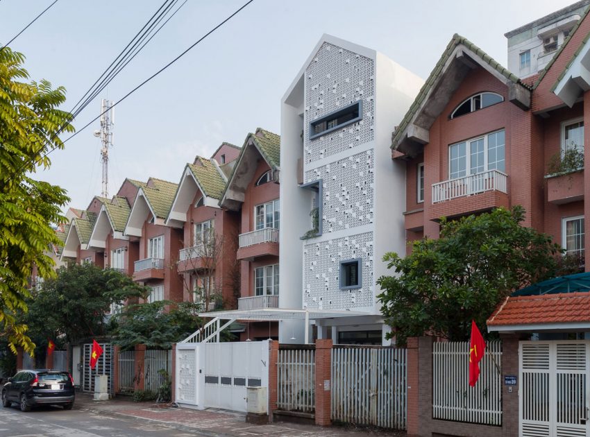 A Row House Transformed into a Bright Home with White Concrete Blocks in Vietnam by LANDMAK ARCHITECTURE (1)