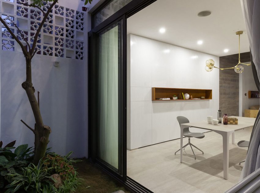 A Row House Transformed into a Bright Home with White Concrete Blocks in Vietnam by LANDMAK ARCHITECTURE (12)