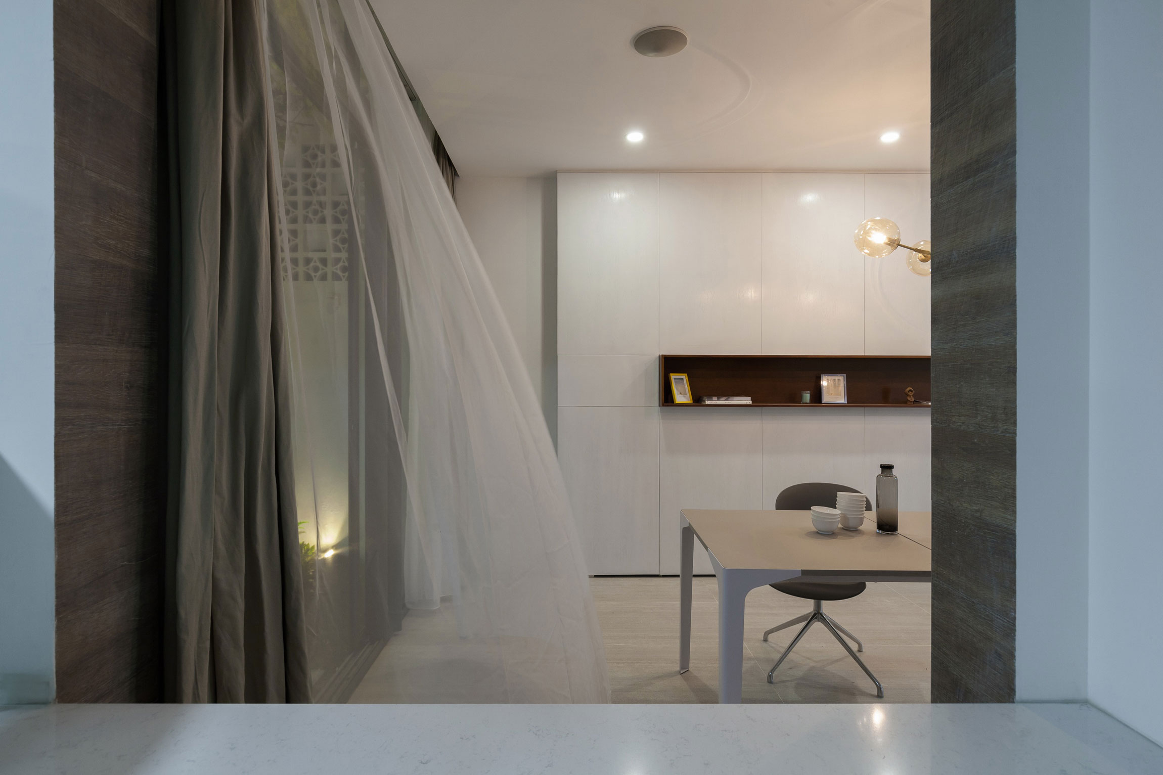 A Row House Transformed into a Bright Home with White Concrete Blocks in Vietnam by LANDMAK ARCHITECTURE (13)