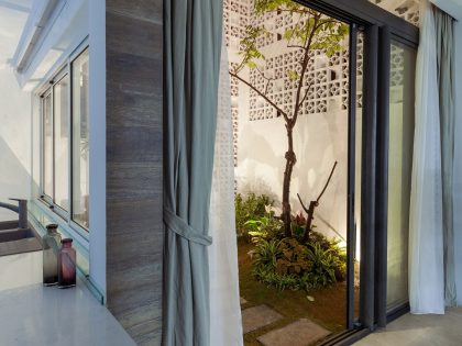 A Row House Transformed into a Bright Home with White Concrete Blocks in Vietnam by LANDMAK ARCHITECTURE (14)