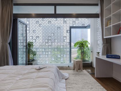 A Row House Transformed into a Bright Home with White Concrete Blocks in Vietnam by LANDMAK ARCHITECTURE (17)