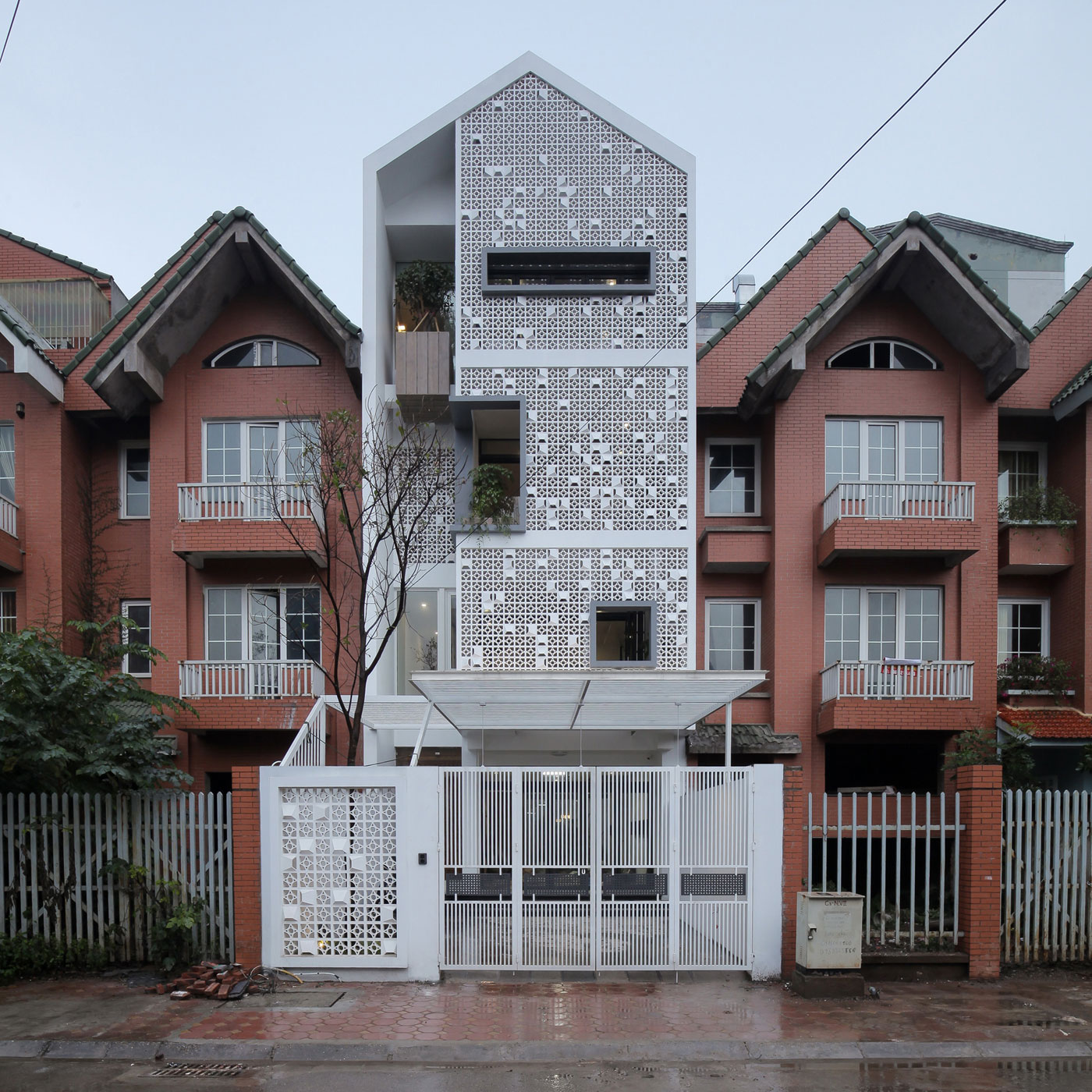 A Row House Transformed into a Bright Home with White Concrete Blocks in Vietnam by LANDMAK ARCHITECTURE (2)