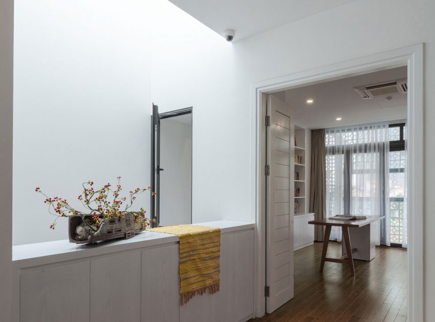 A Row House Transformed into a Bright Home with White Concrete Blocks in Vietnam by LANDMAK ARCHITECTURE (21)