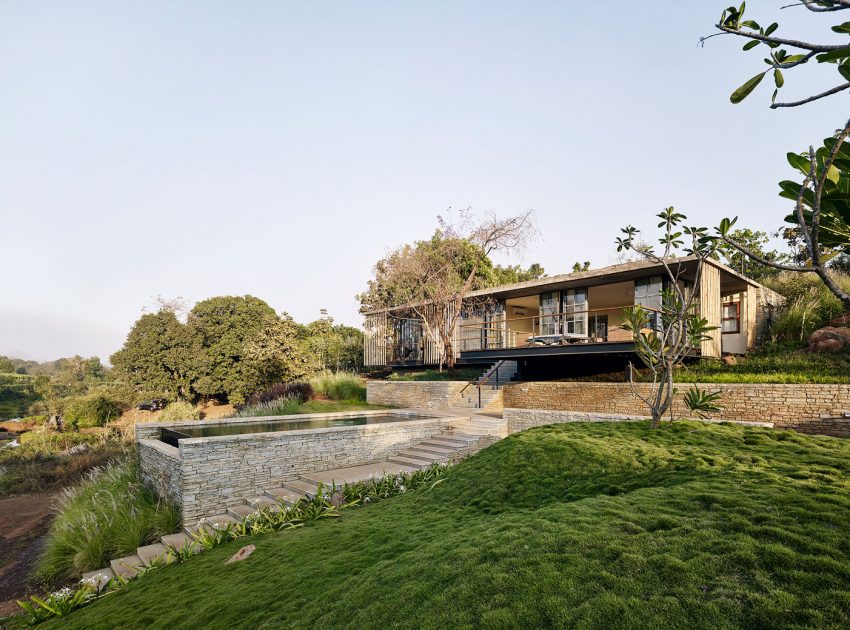 A Rustic Contemporary Home Nestled on Top of a Mountain in Harmony with Nature of Maharashtra by Architecture BRIO (1)