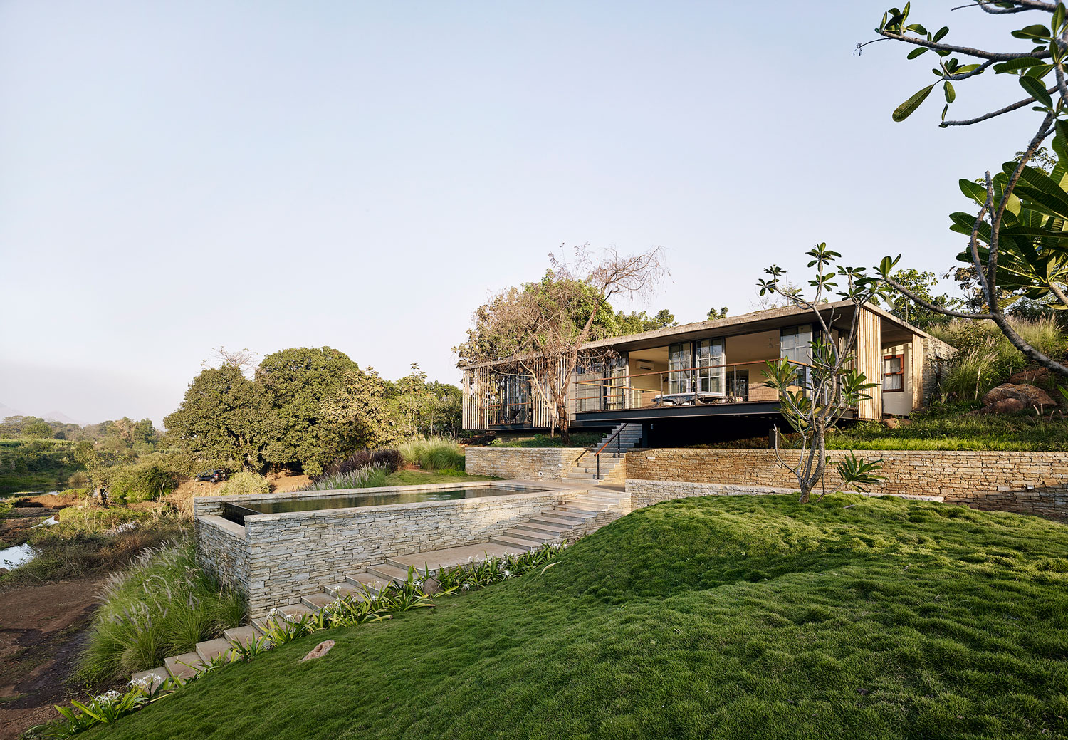 A Rustic Contemporary Home Nestled on Top of a Mountain in Harmony with Nature of Maharashtra by Architecture BRIO (1)