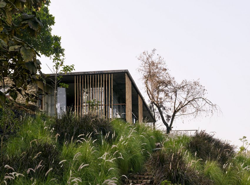 A Rustic Contemporary Home Nestled on Top of a Mountain in Harmony with Nature of Maharashtra by Architecture BRIO (3)