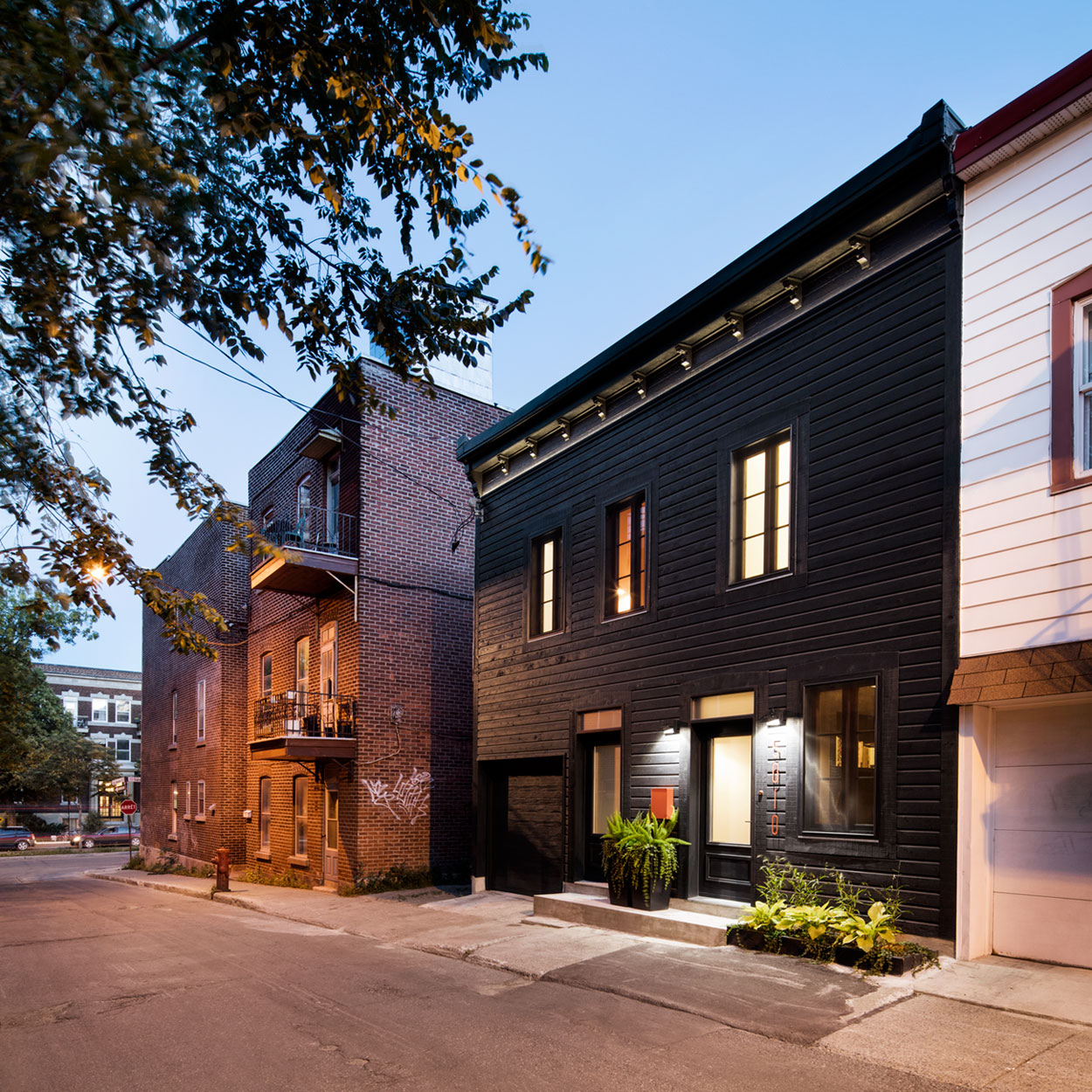 A Small Contemporary House with Bold Black Facade in Montréal by Architecture Open Form (1)