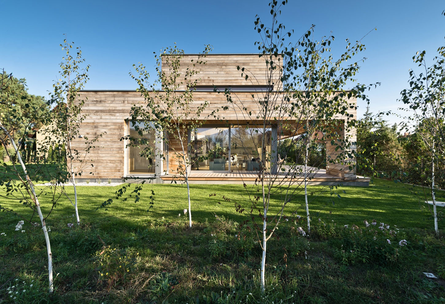 A Spacious Contemporary Wooden Home with Cedar Walls Inside and Out in Poznań by Mariusz Wrzeszcz Office (1)