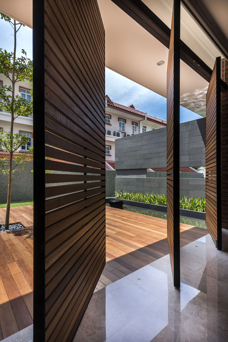 A Spacious Modern House with Wood and Orange Brick Walls in Singapore by Park + Associates Pte Ltd (9)