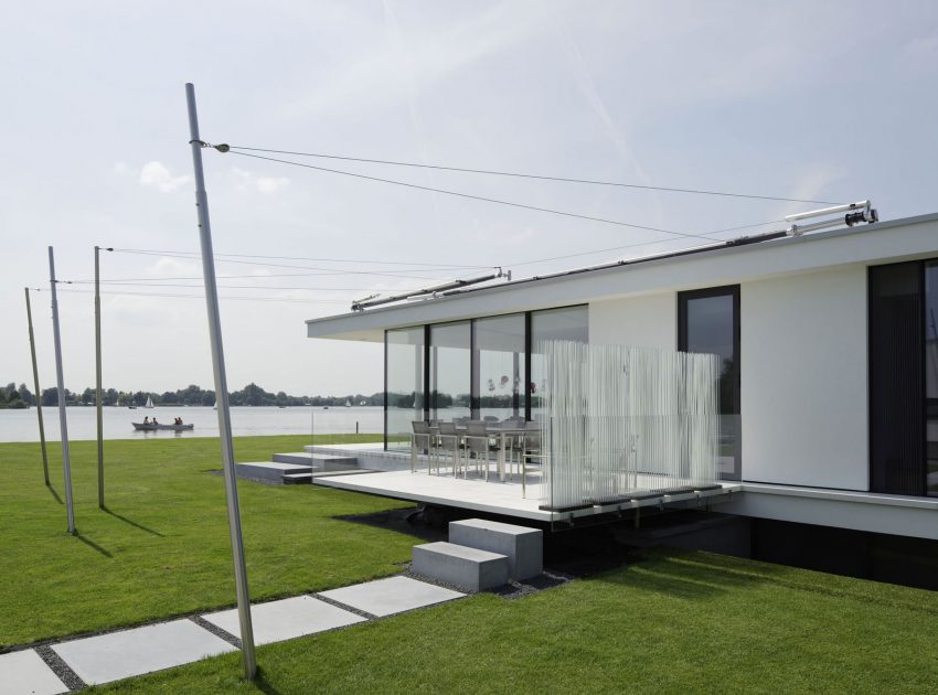 A Striking Contemporary Home with Curved Glass Walls on the Shores of the Reeuwijkse Plassen by Lab32 architecten (13)