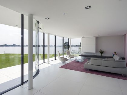 A Striking Contemporary Home with Curved Glass Walls on the Shores of the Reeuwijkse Plassen by Lab32 architecten (17)