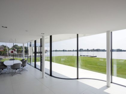 A Striking Contemporary Home with Curved Glass Walls on the Shores of the Reeuwijkse Plassen by Lab32 architecten (19)