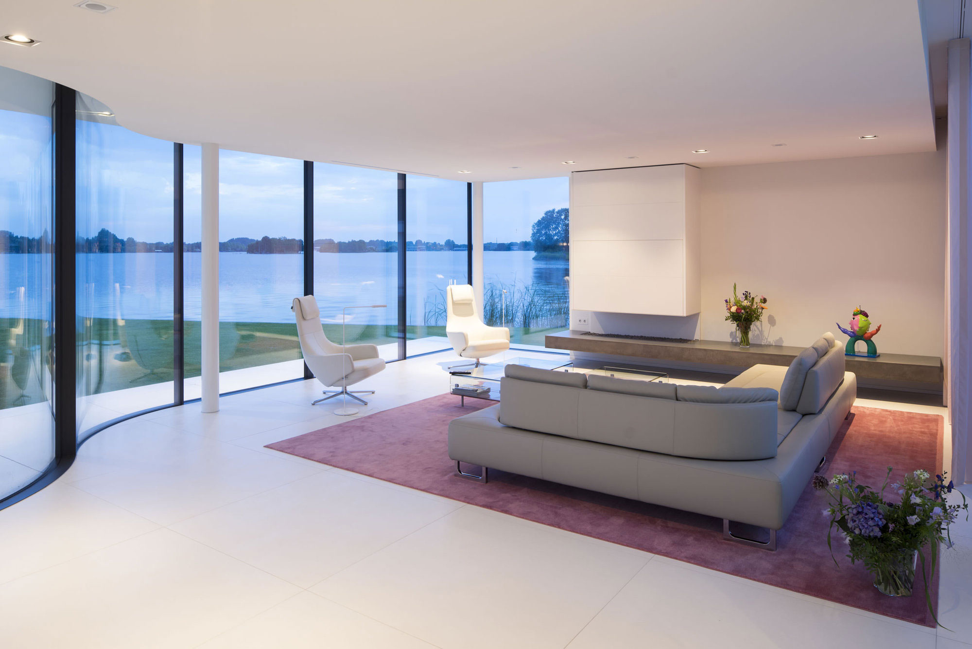 A Striking Contemporary Home with Curved Glass Walls on the Shores of the Reeuwijkse Plassen by Lab32 architecten (28)