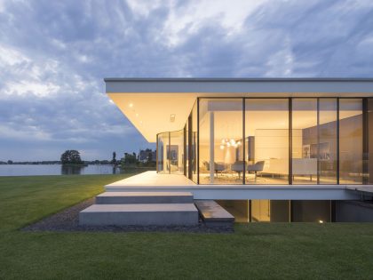 A Striking Contemporary Home with Curved Glass Walls on the Shores of the Reeuwijkse Plassen by Lab32 architecten (30)