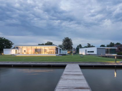 A Striking Contemporary Home with Curved Glass Walls on the Shores of the Reeuwijkse Plassen by Lab32 architecten (33)