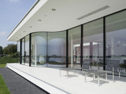 A Striking Contemporary Home with Curved Glass Walls on the Shores of the Reeuwijkse Plassen by Lab32 architecten (5)