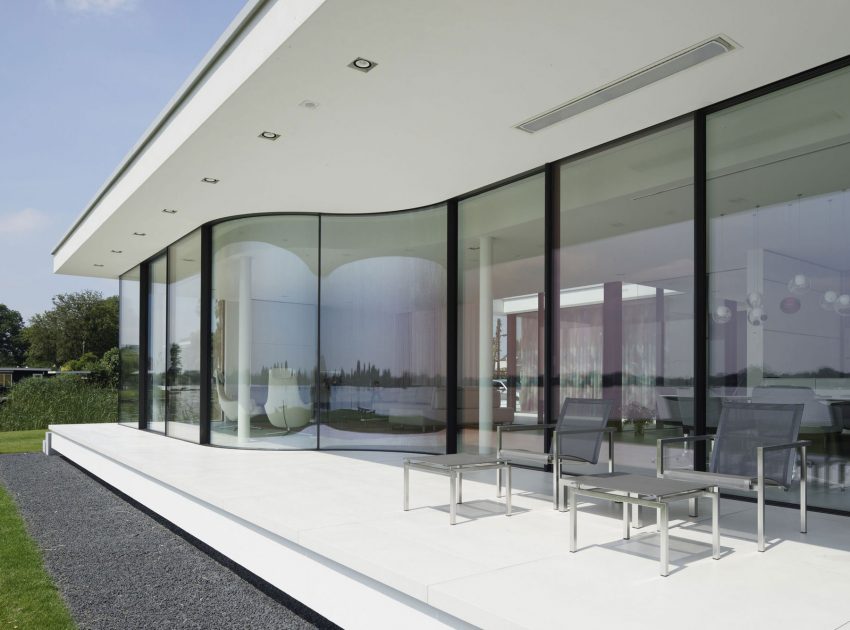 A Striking Contemporary Home with Curved Glass Walls on the Shores of the Reeuwijkse Plassen by Lab32 architecten (5)