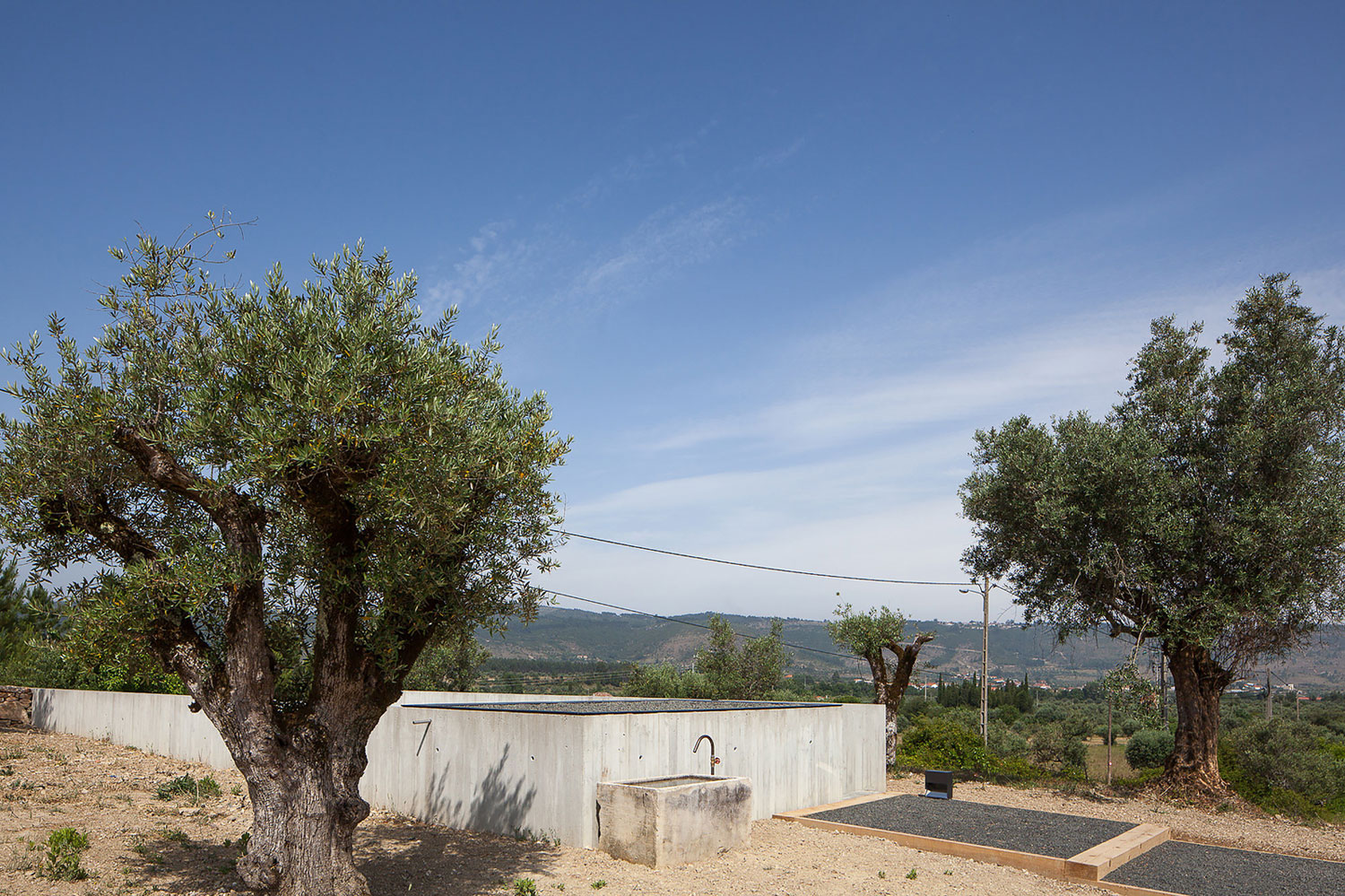 A Stunning Concrete Home Surrounded by Fields and Vegetation in Fonte Boa by João Mendes Ribeiro (13)