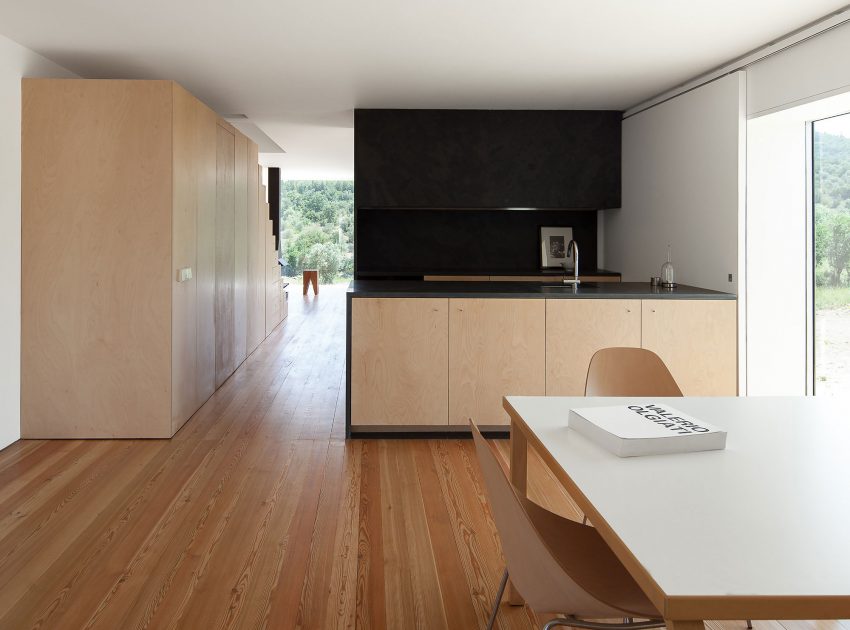 A Stunning Concrete Home Surrounded by Fields and Vegetation in Fonte Boa by João Mendes Ribeiro (20)