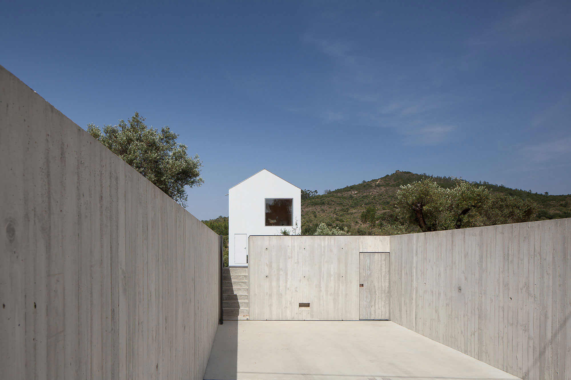 A Stunning Concrete Home Surrounded by Fields and Vegetation in Fonte Boa by João Mendes Ribeiro (3)