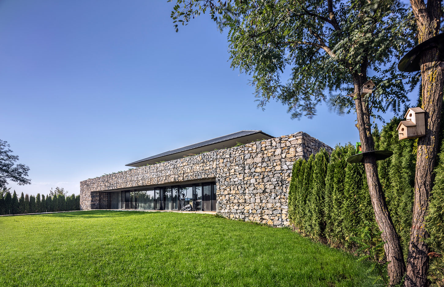 A Stunning Home with Gabion Walls and a Grassy Viewing Deck in Sofia, Bulgaria by I/O Architects (1)