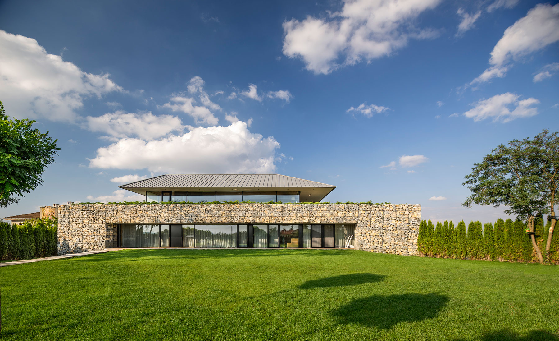 A Stunning Home with Gabion Walls and a Grassy Viewing Deck in Sofia, Bulgaria by I/O Architects (2)