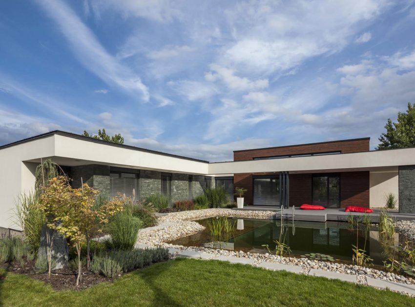 A Stunning L-Shaped Modern House for a Four-Person Family in Mosonmagyaróvár, Hungary by TOTH PROJECT (1)