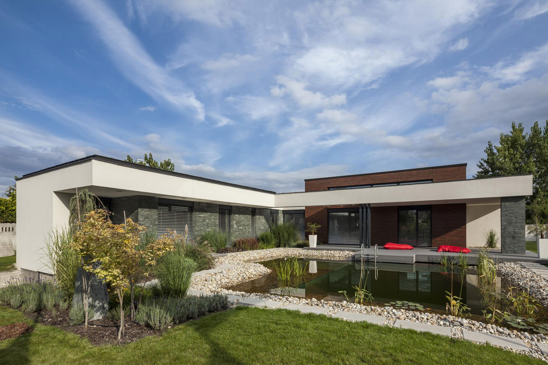 A Stunning L-Shaped Modern House for a Four-Person Family in Mosonmagyaróvár, Hungary by TOTH PROJECT (1)