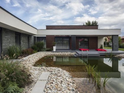 A Stunning L-Shaped Modern House for a Four-Person Family in Mosonmagyaróvár, Hungary by TOTH PROJECT (3)