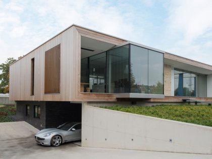 A Stunning and Luminous Contemporary Home on the Edge of a Pretty Man-Made River