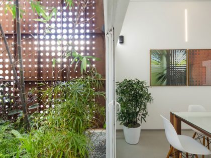 A Stunning and Spacious Home Framed by Perforated Corten Steel Walls in Kerala, India by LIJO.RENY Architects (13)