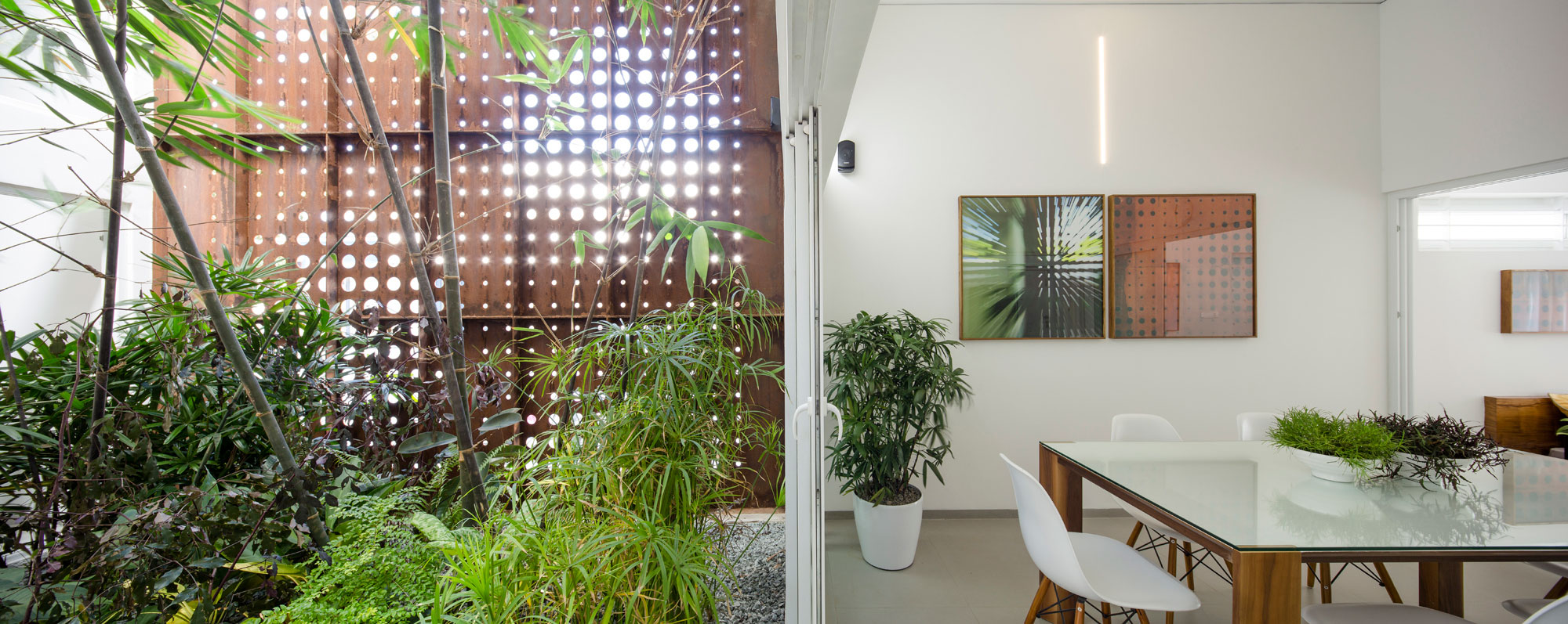 A Stunning and Spacious Home Framed by Perforated Corten Steel Walls in Kerala, India by LIJO.RENY Architects (13)