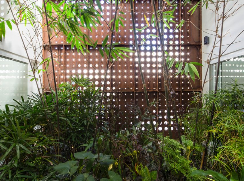 A Stunning and Spacious Home Framed by Perforated Corten Steel Walls in Kerala, India by LIJO.RENY Architects (14)