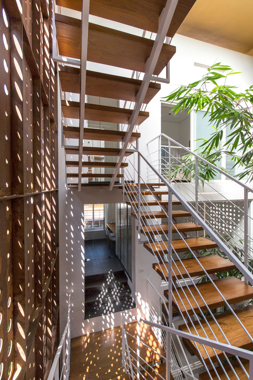 A Stunning and Spacious Home Framed by Perforated Corten Steel Walls in Kerala, India by LIJO.RENY Architects (17)